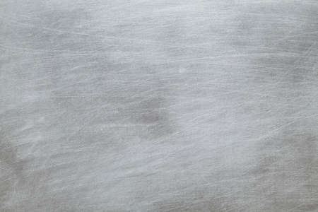 Scratched surface of the metal plateの写真素材