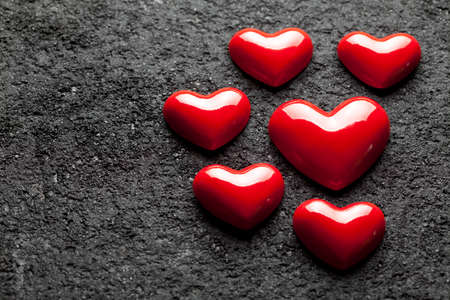 Red hearts on black  background