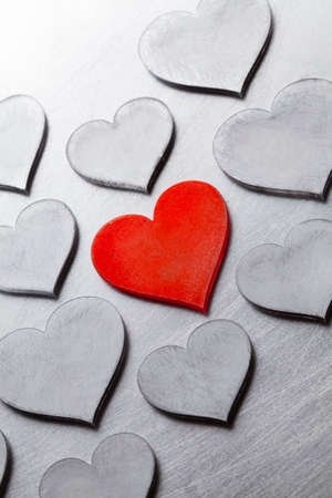 Scratched metal hearts on cracked metal surfaceの写真素材