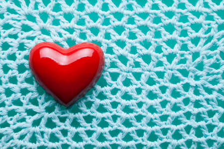 Red heart on blue patterned background
