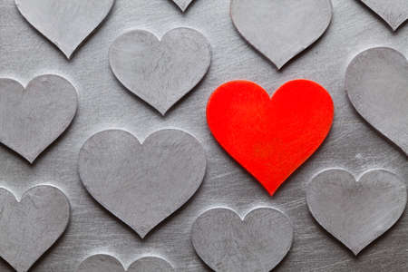 Scratched metal hearts on cracked metal surfaceの写真素材