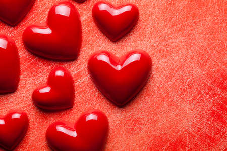 Red hearts on scratched backgroundの写真素材