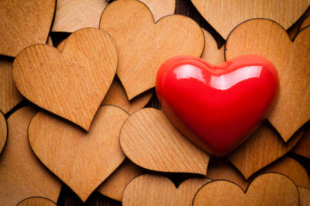Red heart on wooden hearts backgroundの写真素材
