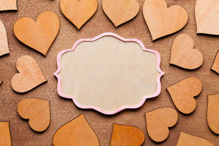 Wooden hearts on paper backgroundの写真素材