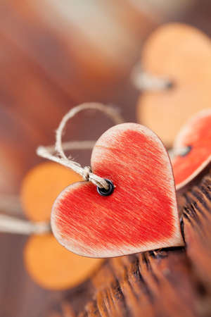 Wooden hearts on old planks tableの写真素材