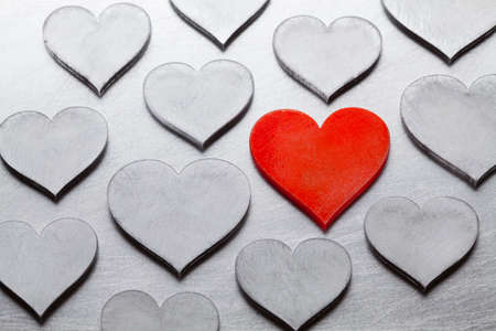 Scratched metal hearts on cracked metal surfaceの写真素材