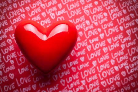 Red heart on paper backgroundの写真素材