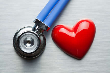 Stethoscope and heart as a symbol of caring for healthの写真素材