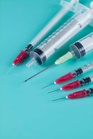 Syringe on a blue backgroundの写真素材