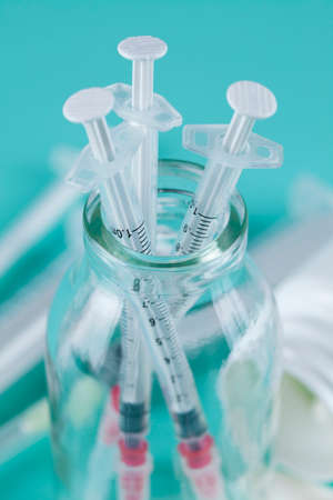 Syringe on a blue backgroundの写真素材