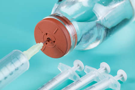 Syringe and glass bottle with medicineの写真素材