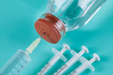 Syringe and glass bottle with medicineの写真素材