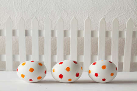 Patterned easter eggs on wooden tableの写真素材