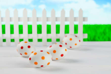 Patterned easter eggs on wooden tableの写真素材