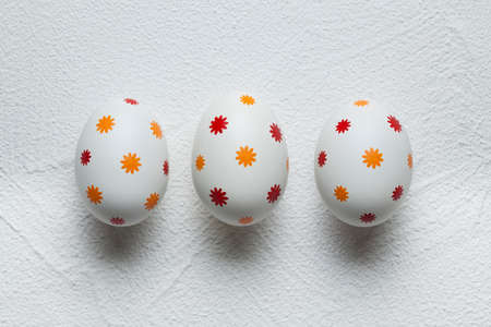 Patterned easter eggs on plastered backgroundの写真素材