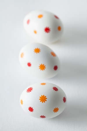 Patterned easter eggs on plastered backgroundの写真素材