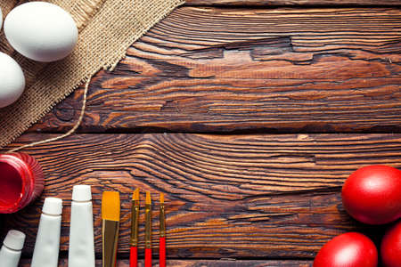 Easter eggs ready to be painted on wooden tableの写真素材