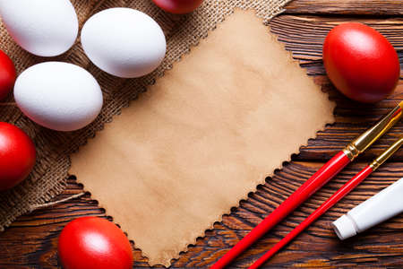 Easter eggs ready to be painted and blank paper cardの写真素材