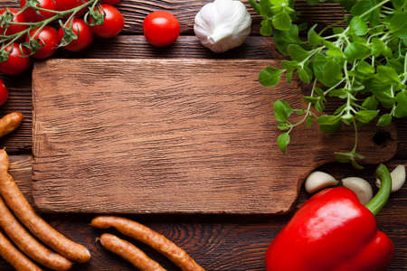 Food ingredients - Meat, vegetables and herbs on wooden backgroundの写真素材