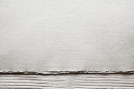 White paper sheet on wooden planksの写真素材