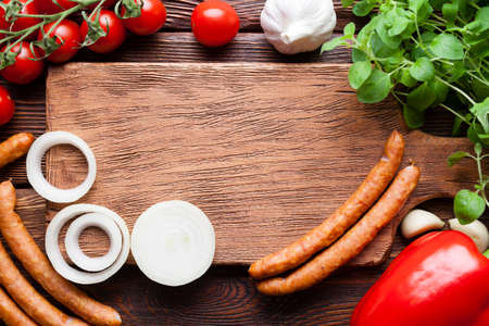 Food ingredients - Meat, vegetables and herbs on wooden boardの写真素材