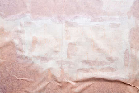 Wet wrinkled paper sheet - grunge background or textureの写真素材
