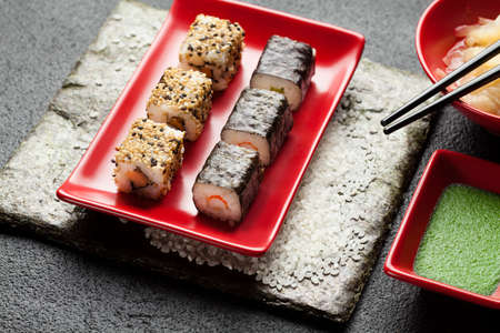 Traditional japanese cuisine - sushi set on black tableの写真素材