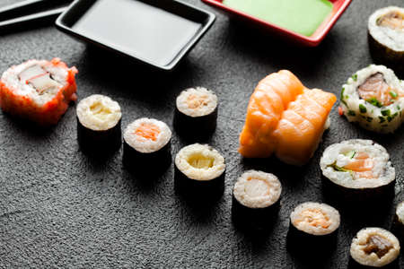 Traditional japanese cuisine sushi on black tableの写真素材