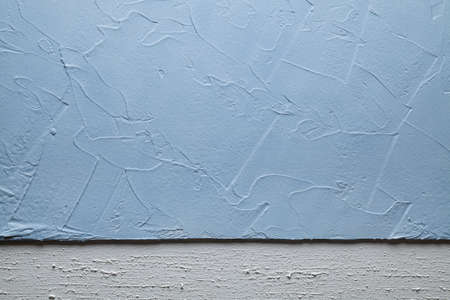 White and blue plaster on the wall background or textureの写真素材