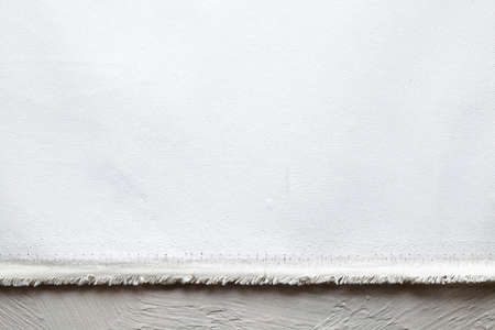 Blank paper sheet on white plastered backgroundの写真素材