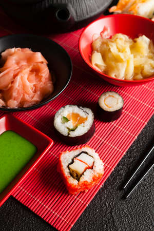 Sushi, ginger and wasabi on red matの写真素材
