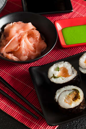 Sushi rolls, wasabi and ginger in a bowlの写真素材