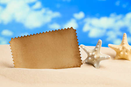 Blank paper sheet on the beachの写真素材