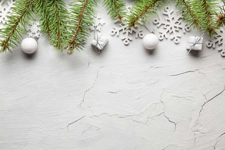 Christmas background - spruce tree, snowflakes, baubles and gifts on white backgroundの写真素材