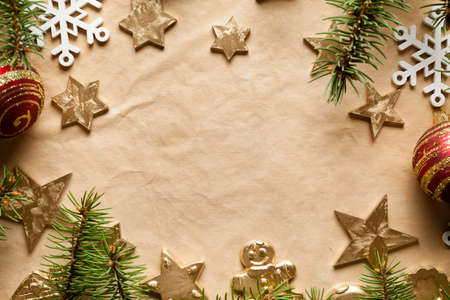 Christmas background - paper sheet and Christmas decorationsの写真素材
