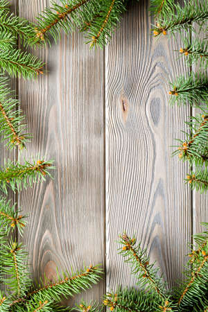 Christmas background - spruce tree on wooden tableの写真素材