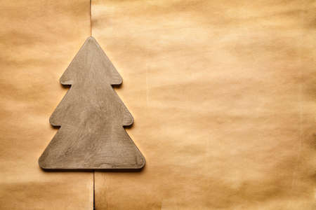 Christmas tree on handmade paper sheet backgroundの写真素材