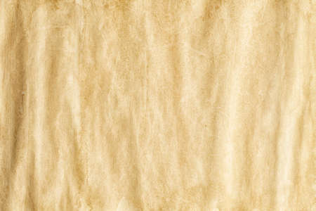 Crumpled handmade paper sheet - background or textureの写真素材