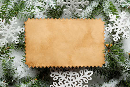 Christmas background - handmade paper sheet, snowflakes and spruce tree の写真素材