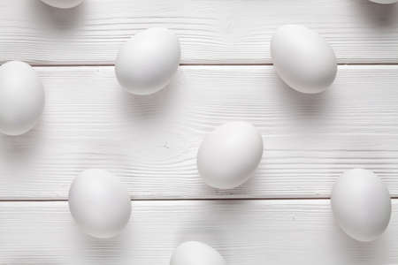 White easter eggs on wooden tableの写真素材
