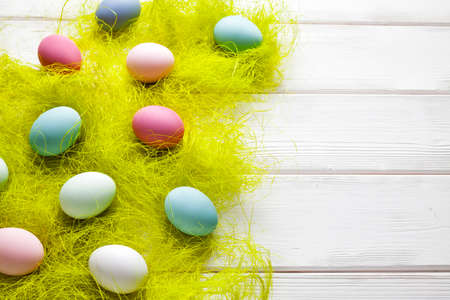 Colored Easter eggs on wooden backgroundの写真素材