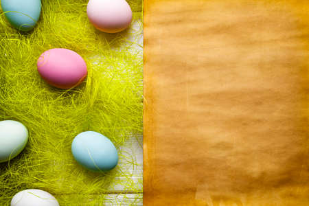 Easter background - Blank handmade paper sheet and colored eggsの写真素材