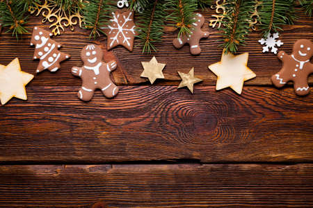 Gingerbread cookies for Christmas, stars and snowflakes on old wooden tableの写真素材
