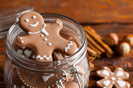Gingerbread cookies in a jar and wooden tableの写真素材