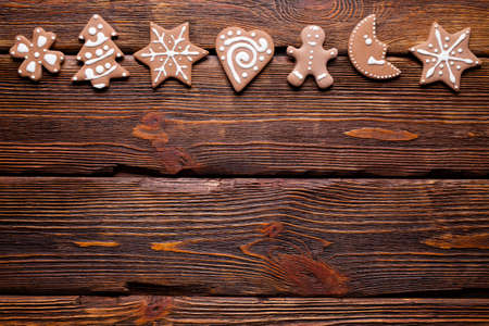 Gingerbread Christmas cookies on wooden backgroundの写真素材