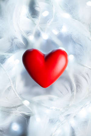 Red heart on white and gray abstract backgroundの写真素材