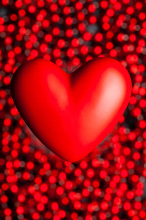 Valentine's red heart on abstract bokeh backgroundの写真素材