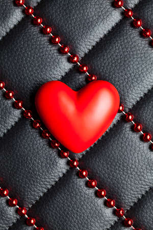 Red heart on black leather background - Valentine's Day card templateの写真素材