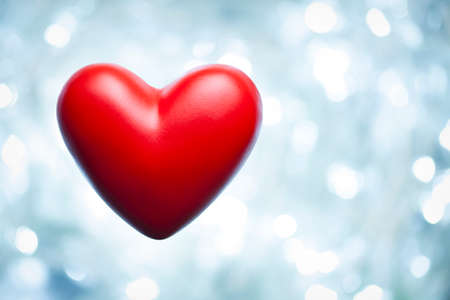 Red heart on abstract lighting backgroundの写真素材