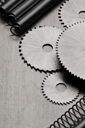 Several discs for the circular saw and metal springs on the tableの写真素材